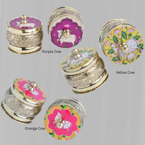Brass kumkum box with decorative floral artwork – perfect for Varalakshmi Vratham and wedding return gifts