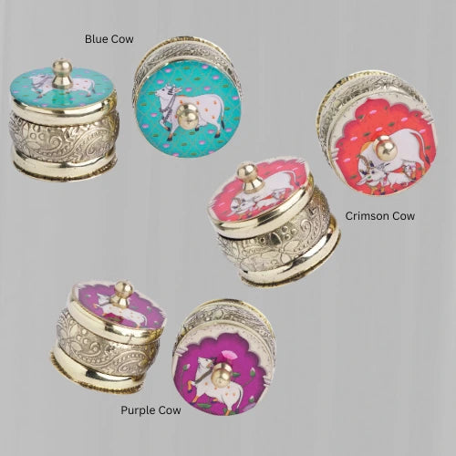 Assorted brass kumkum holders in pastel enamel motifs – traditional thamboolam return gifts
